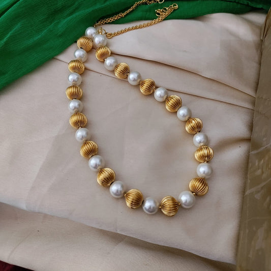 Long shell pearl with golden ball Necklace