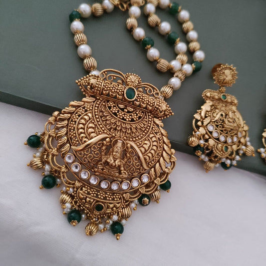 Long beaded necklace with lakshmi pendant