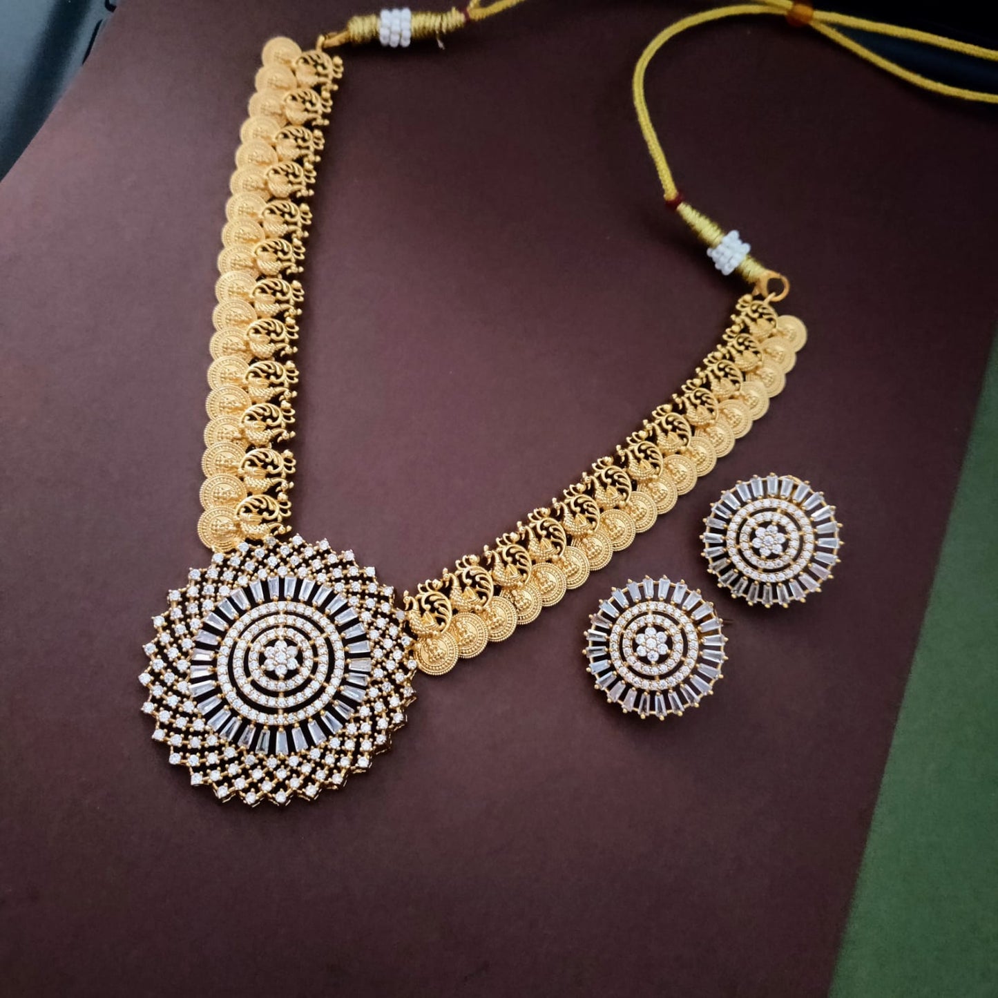 Lakshmi coin necklace with round white pendant in the middle