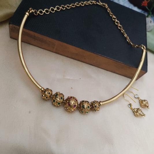 Golden stone studded ball with tube necklace set