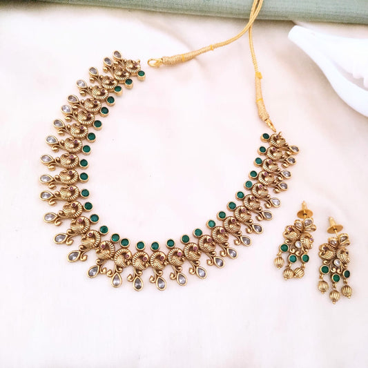 Timeless beauty of peacock paired with emerald stone necklace